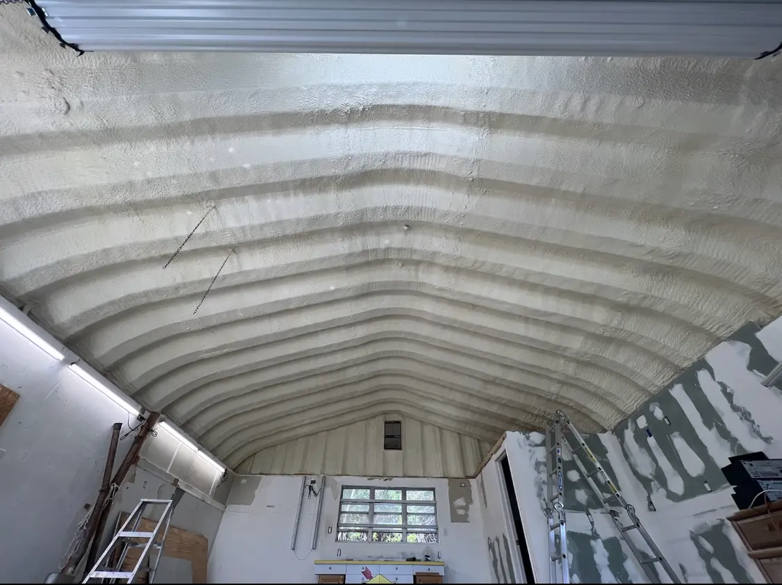 Spray polyurethane foam applied to the underside of a metal roof deck in Pleasant Garden